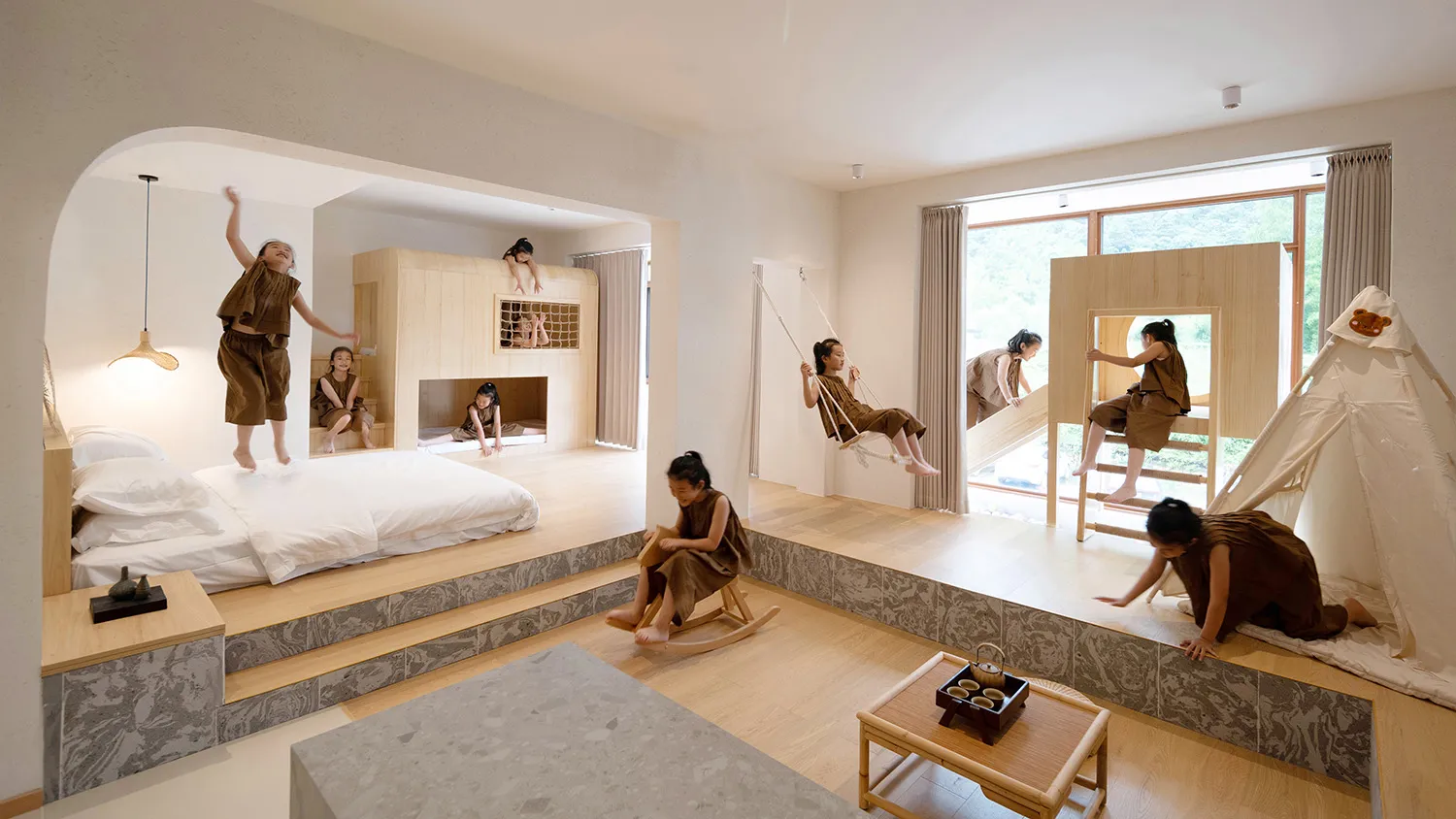 Children's playroom with modern design, wood furniture, and play structures.