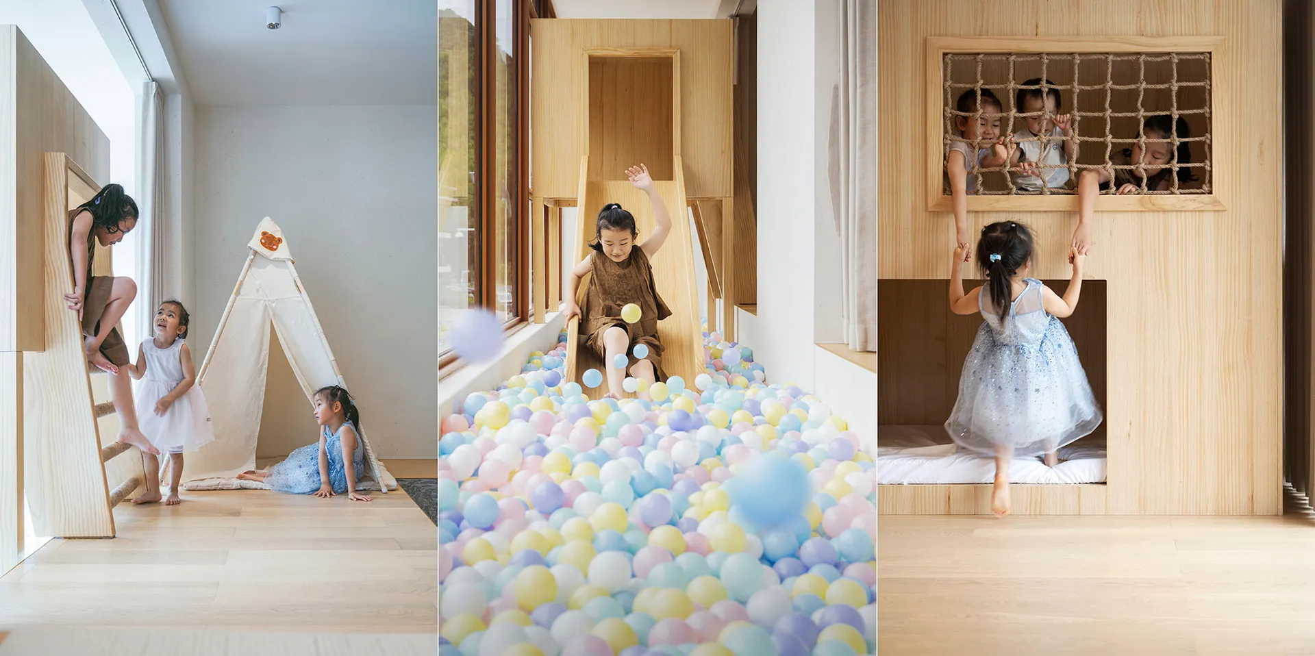 Child playing in a colorful ball pit with a wooden slide and tent in a modern play space interior