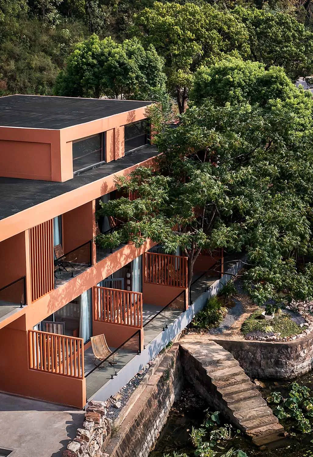 Modern residential building with concrete and glass exterior.