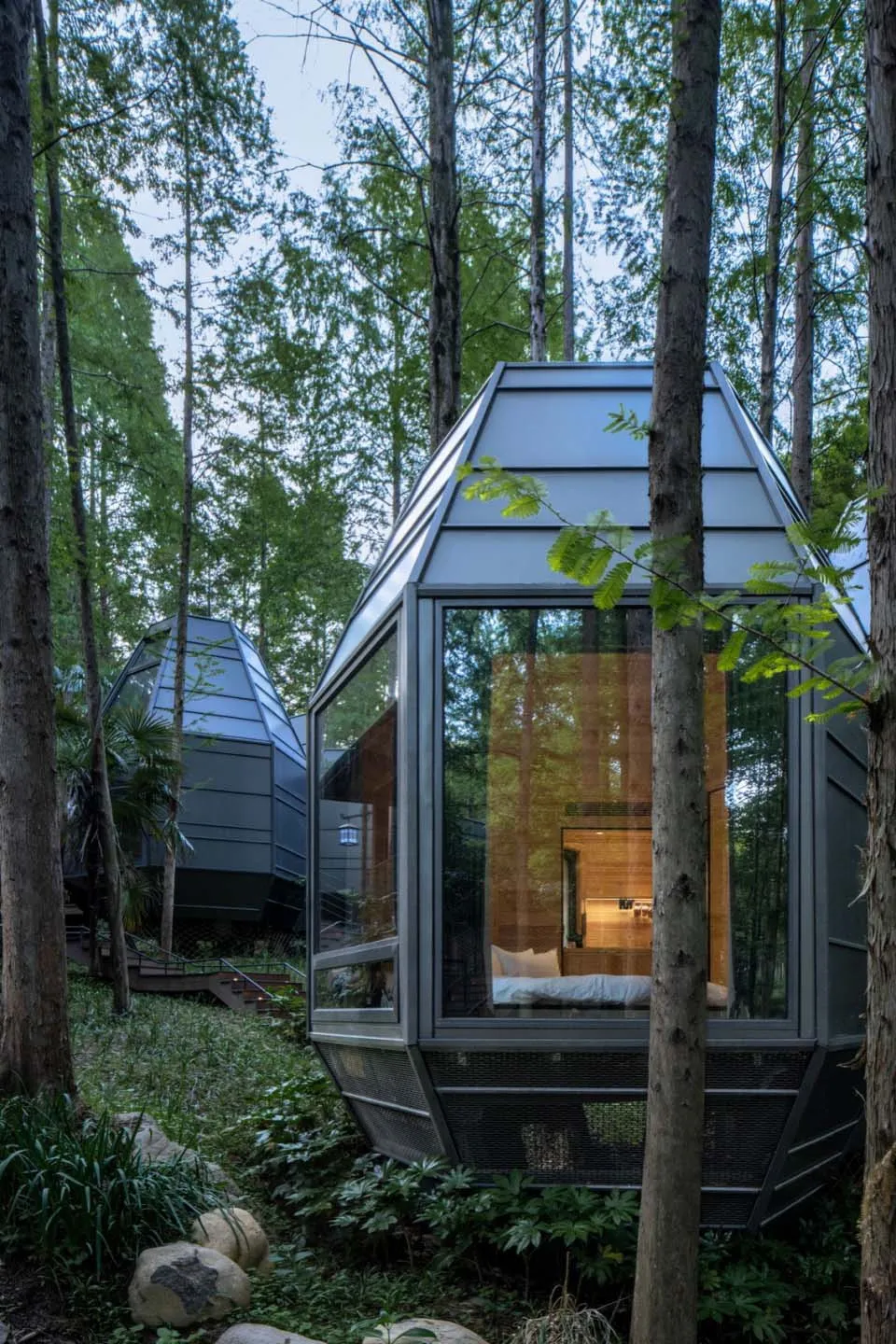 Modern residential cabin with metal, glass, and wood