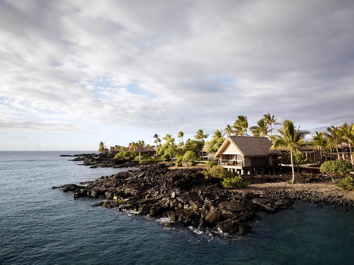 Vacation resort with natural elements near the ocean.