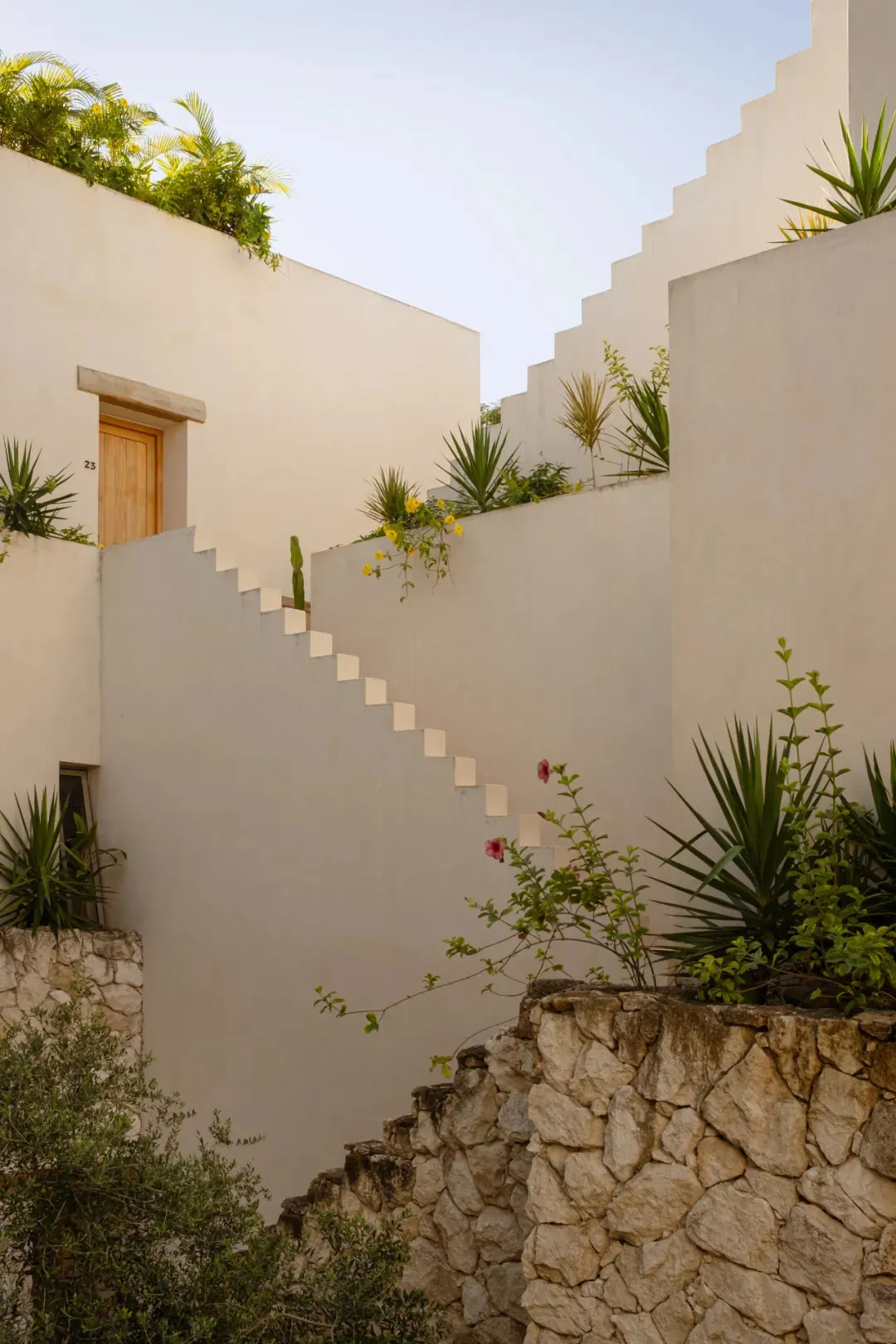 Stairs built into a wall with concrete steps leading upwards.