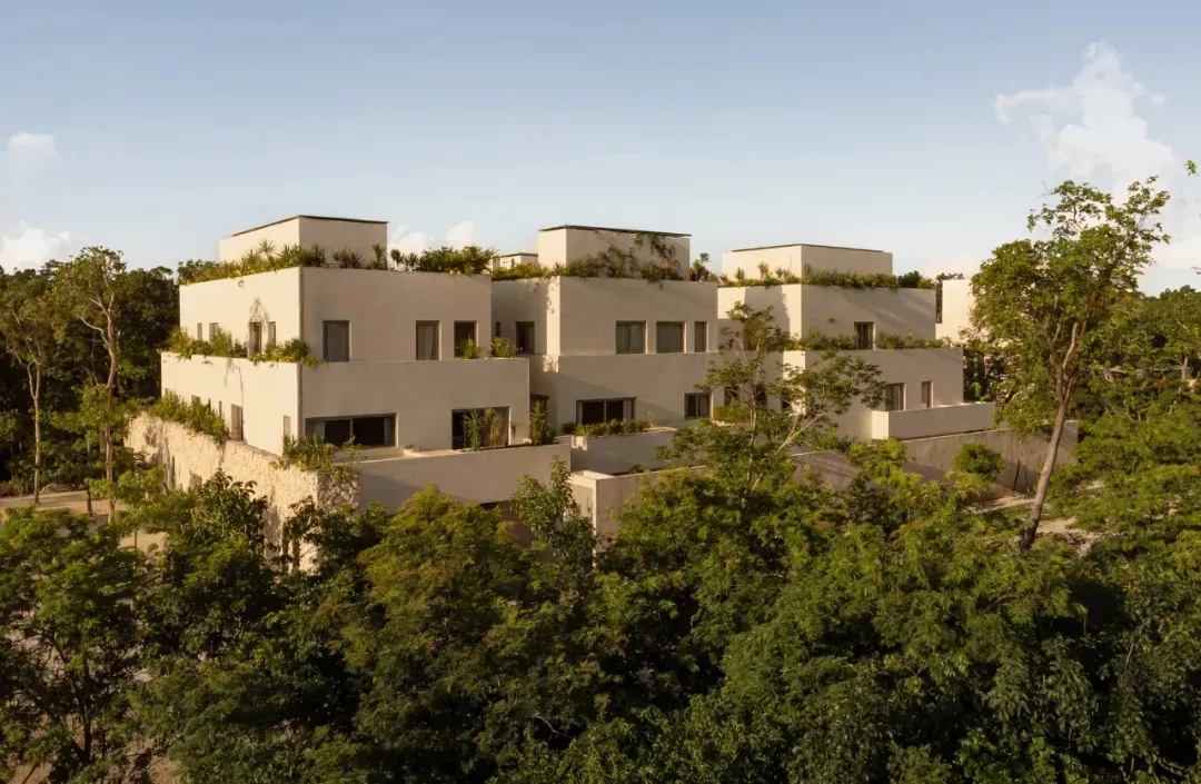 Modern residential home featuring concrete and glass terraces.