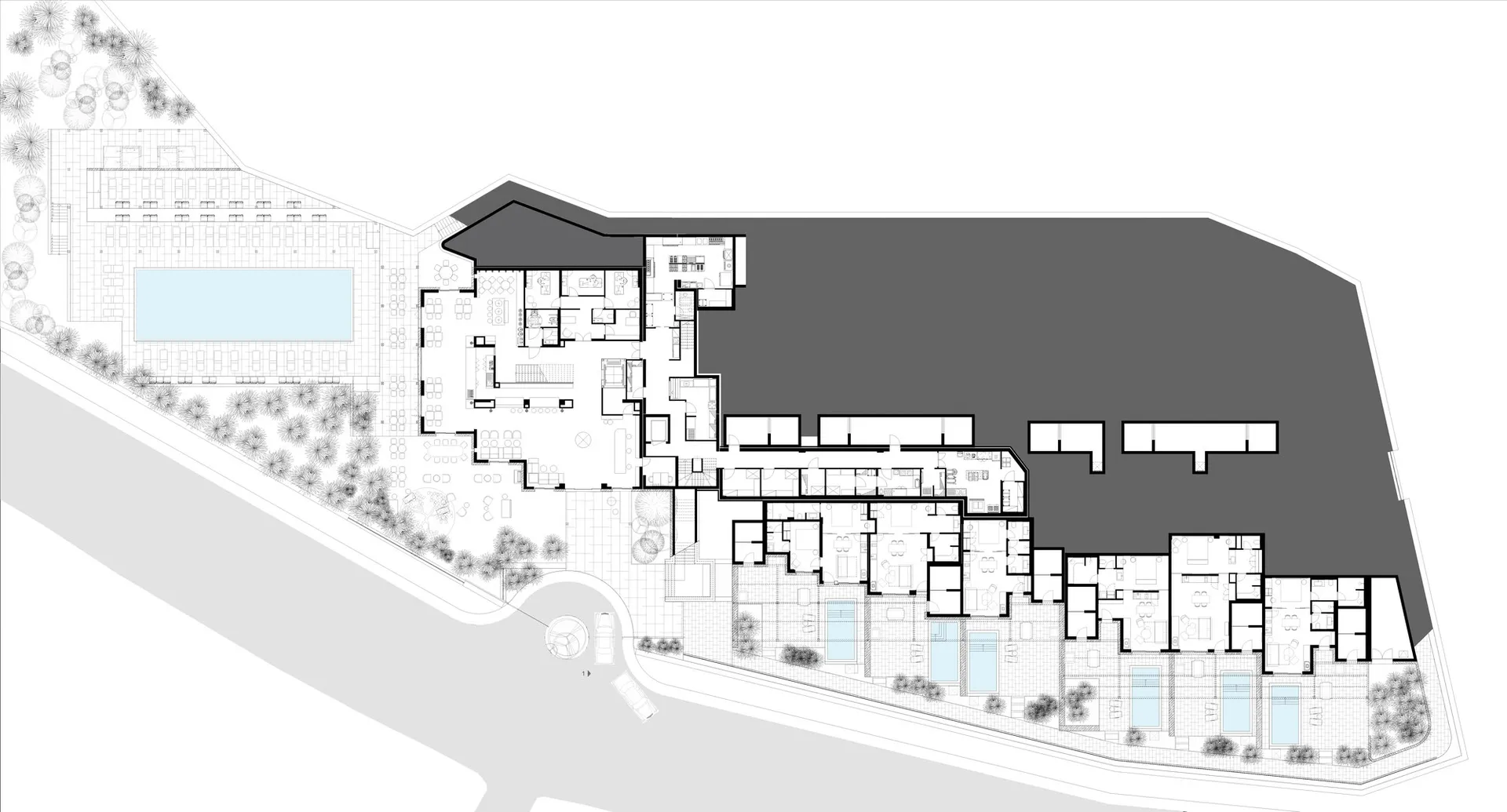 Floor plan of a modern residential building with concrete and glass materials.