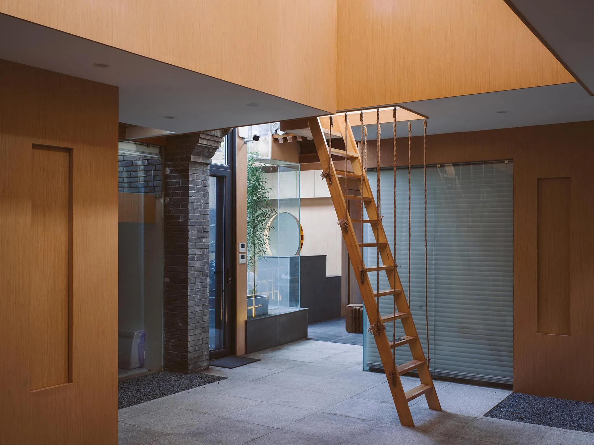 A minimalist interior design featuring a wooden ladder