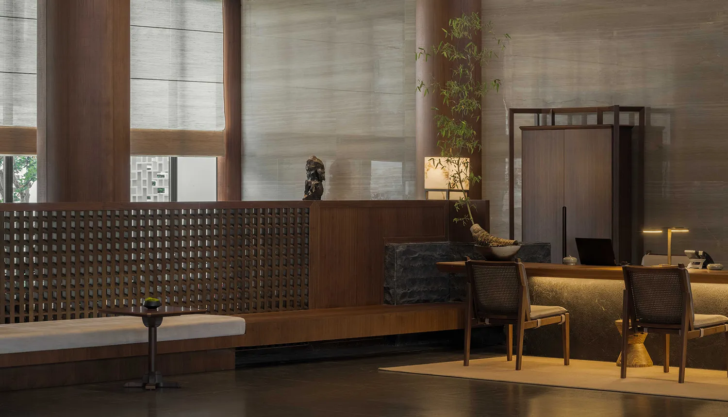 A minimalist lobby with wooden walls and furniture