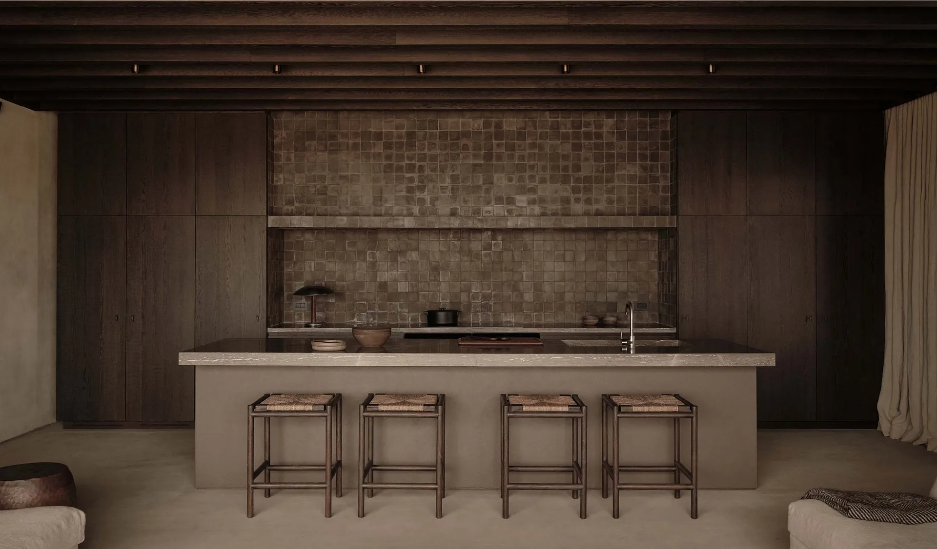 Modern kitchen featuring stone countertops and flooring.