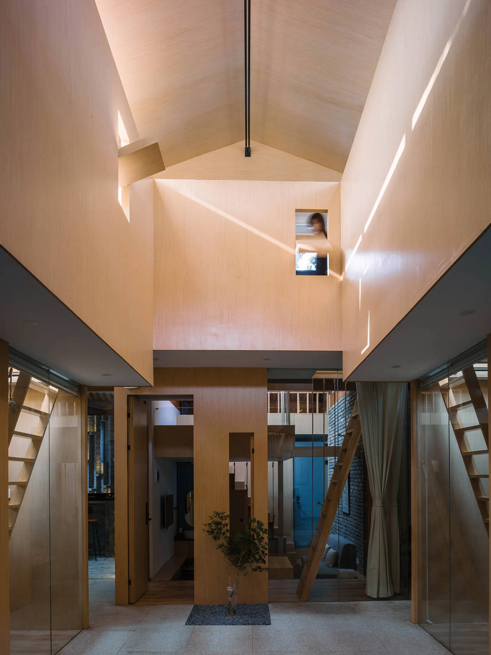 Modern residential interior design featuring wooden elements.