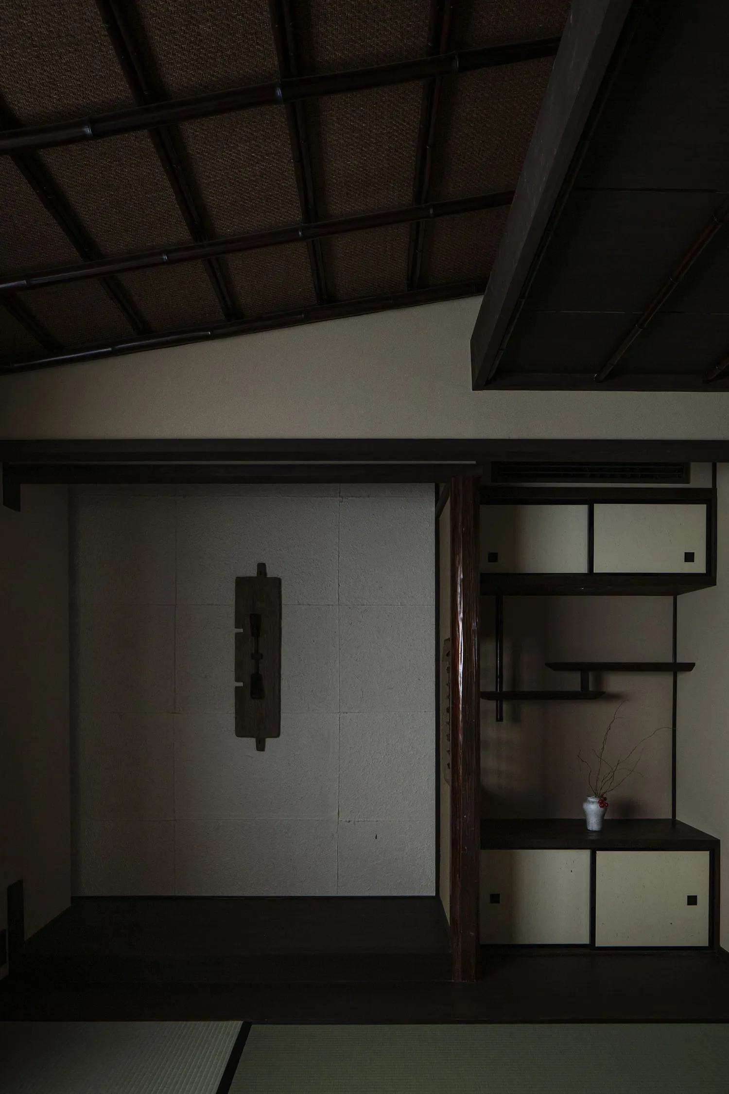 A modern interior with a wooden closet featuring a traditional Japanese design.