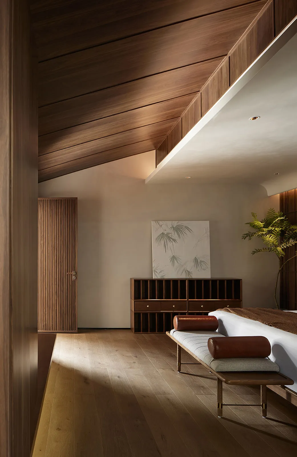 A minimalist interior design featuring wooden elements and a spacious layout.