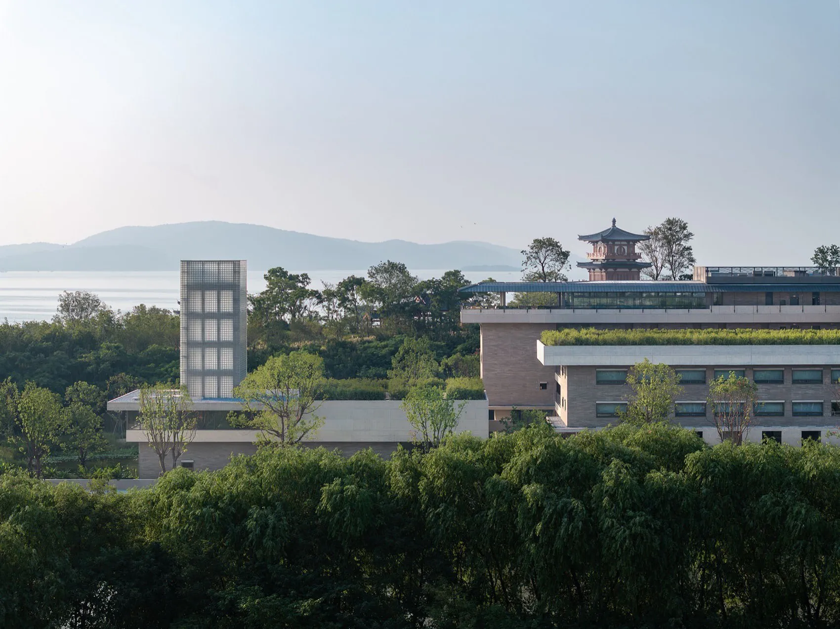 A modern residential building featuring glass exteriors