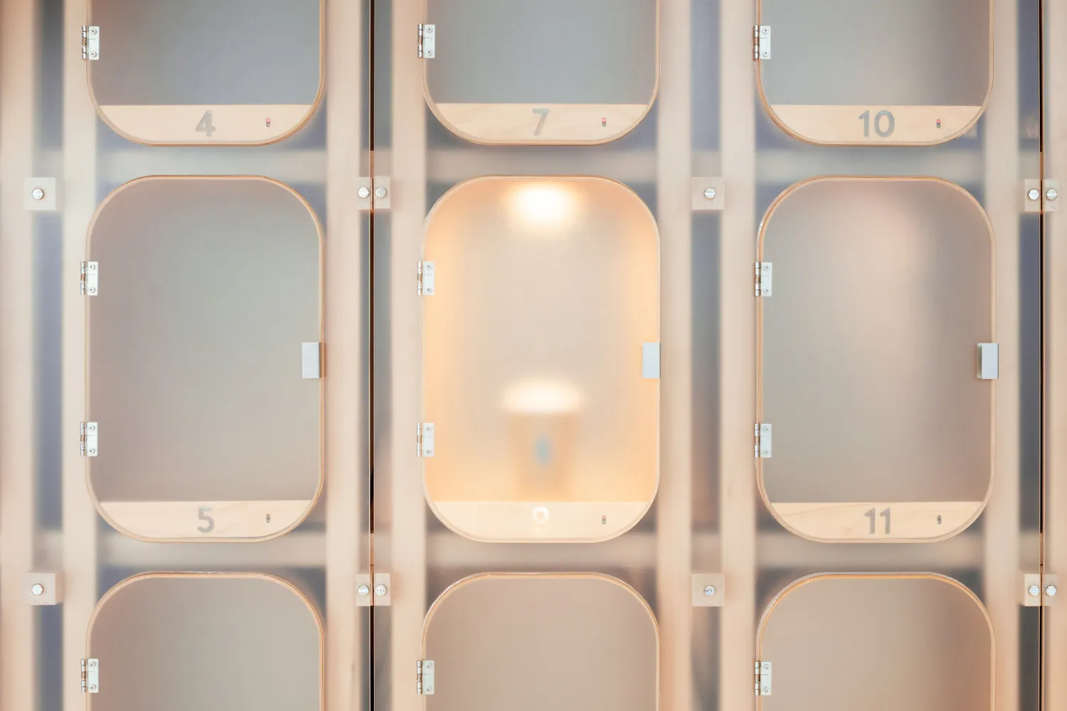 Minimalist hotel lobby featuring glass lighting fixtures