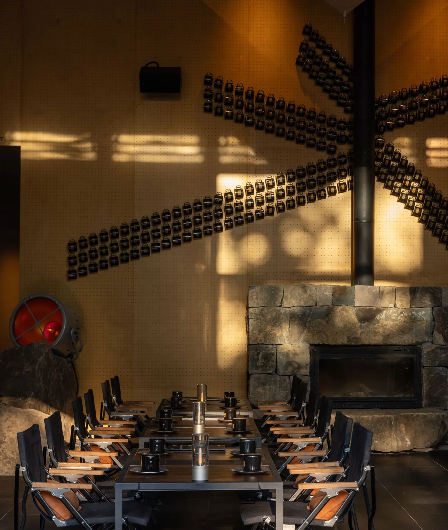 An industrial-themed cafe featuring metal, wood, and stone materials.
