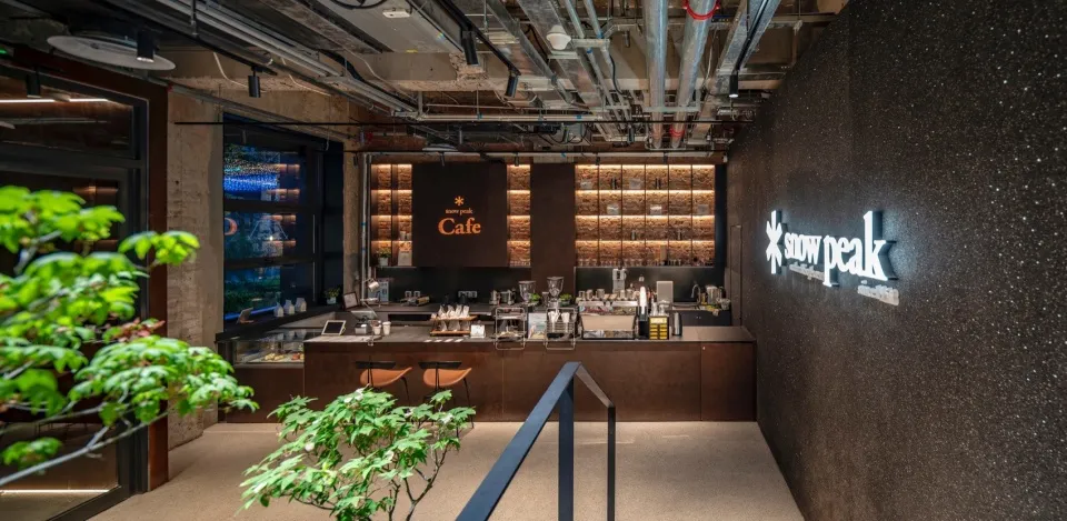 Industrial-style coffee shop interior with metal finishes and modern design