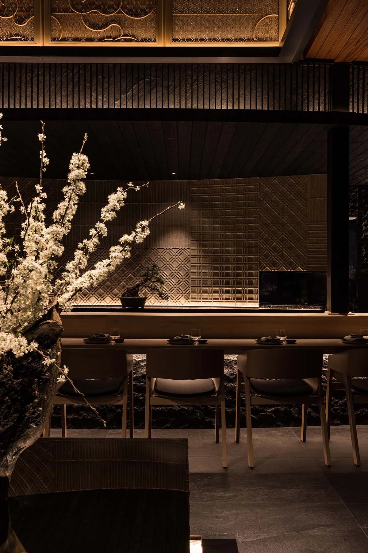 Modern restaurant interior with dark space, contemporary design, and contemporary furniture.