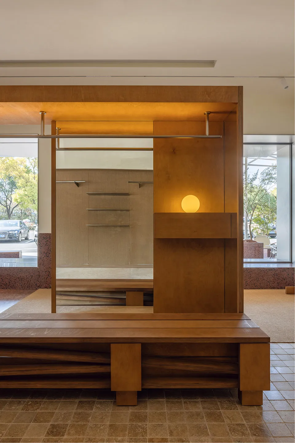 Modern storefront with wooden elements and glass doors.