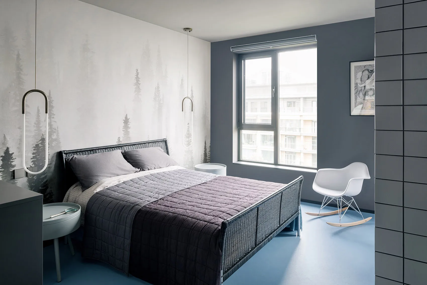 A modern minimalist bedroom featuring a rattan bed frame and minimalist decor.