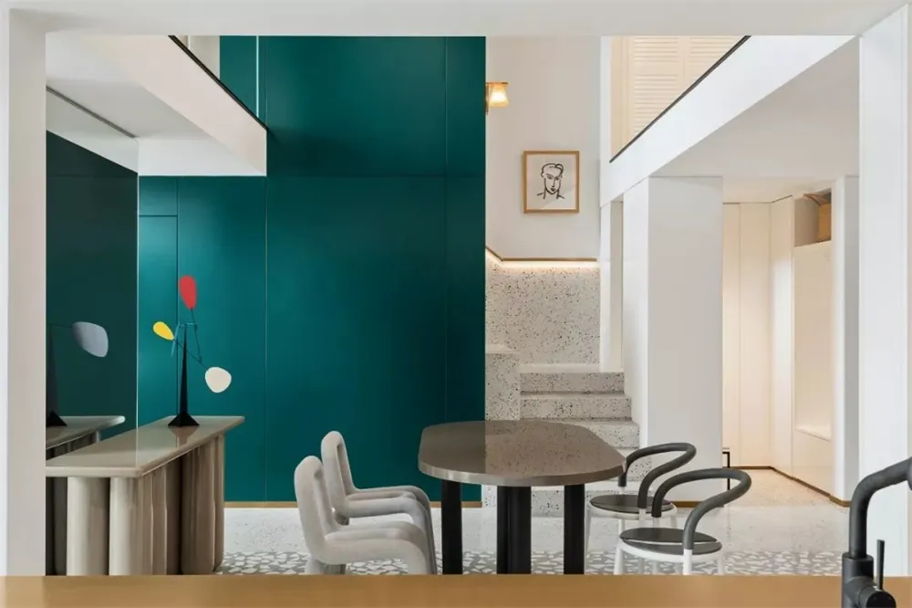 Modern commercial space featuring a mix of terrazzo and concrete surfaces.