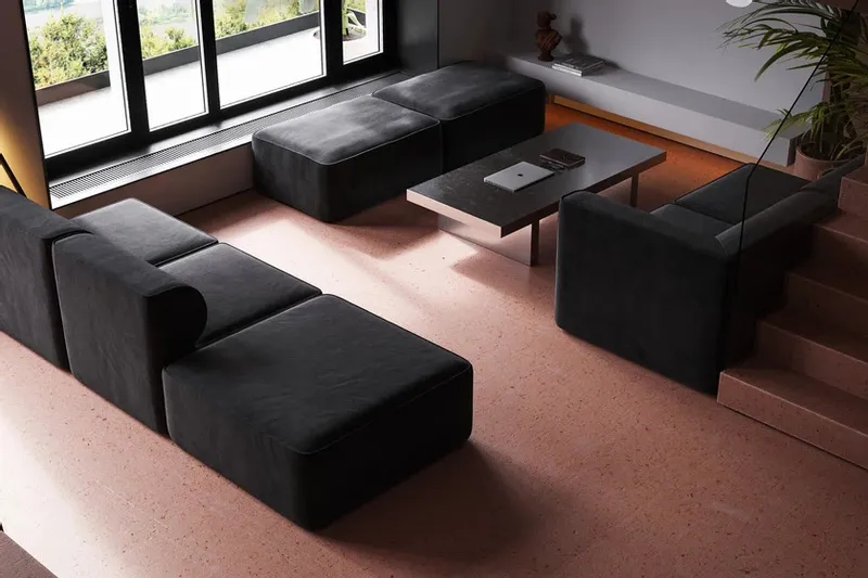 A modern, industrial-style living room featuring concrete furniture and minimalist decor.
