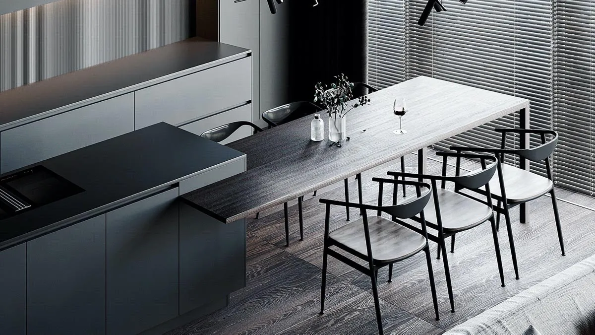 A minimalist residential kitchen features a long wooden table and black chairs.