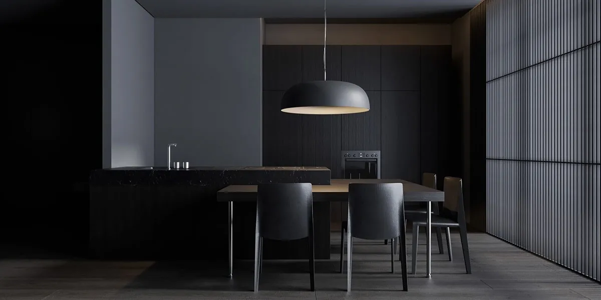 A modern kitchen with black marble countertops and black cabinets