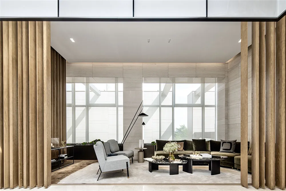 A modern living room with neutral-toned furniture and minimalistic decor.