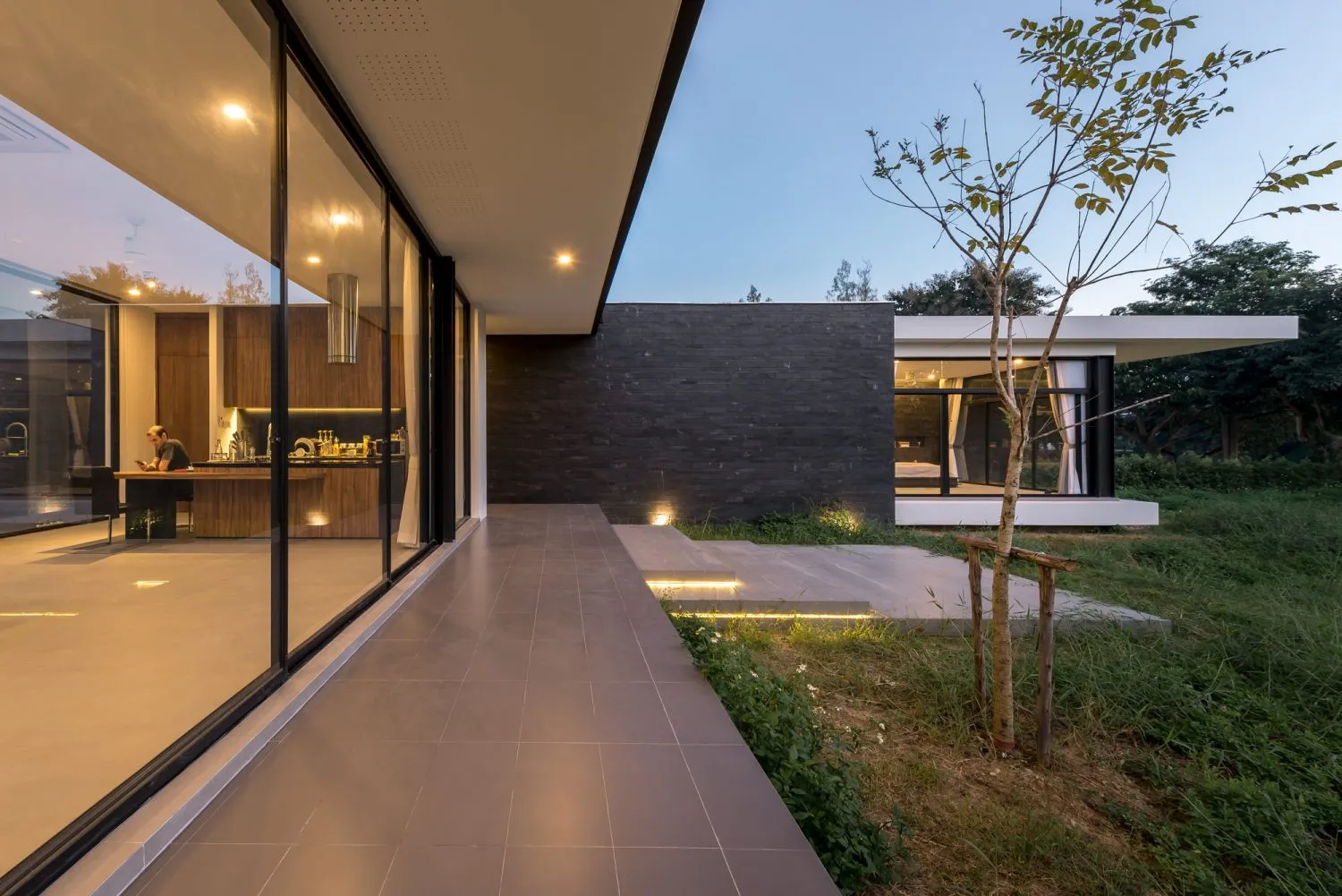 Modern residential architecture featuring concrete and glass materials.