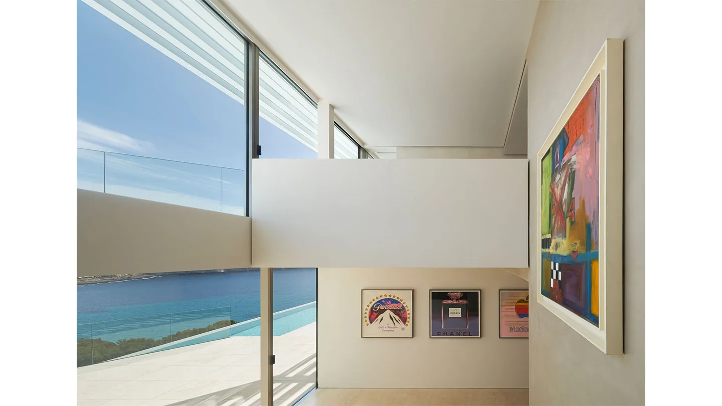 A modern residential interior featuring colorful decorative paintings with visible brush strokes.