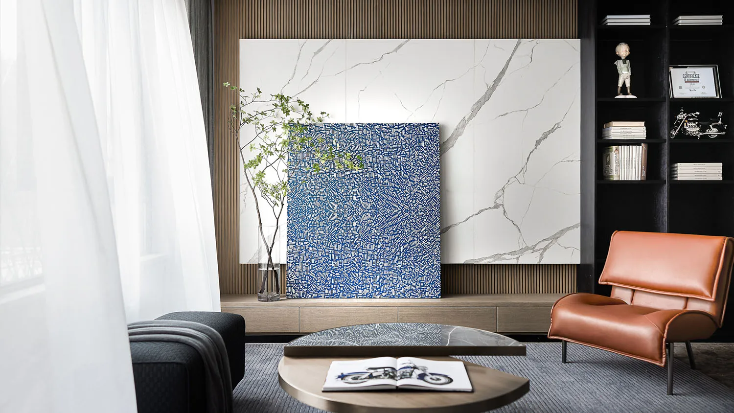 A modern living room featuring a blue and white abstract painting with marble walls and a leather chair.