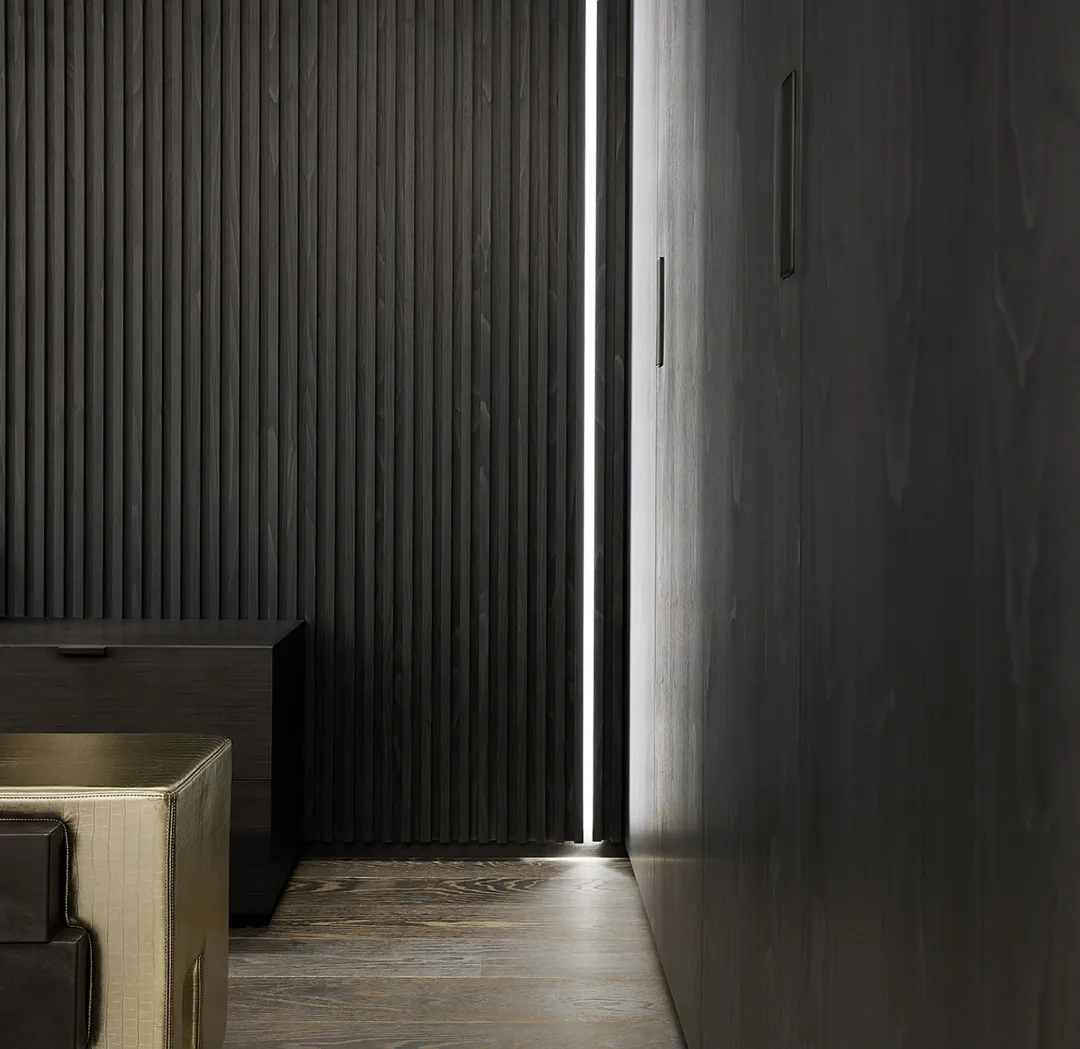 A modern interior space featuring dark wooden panels and minimalist design.
