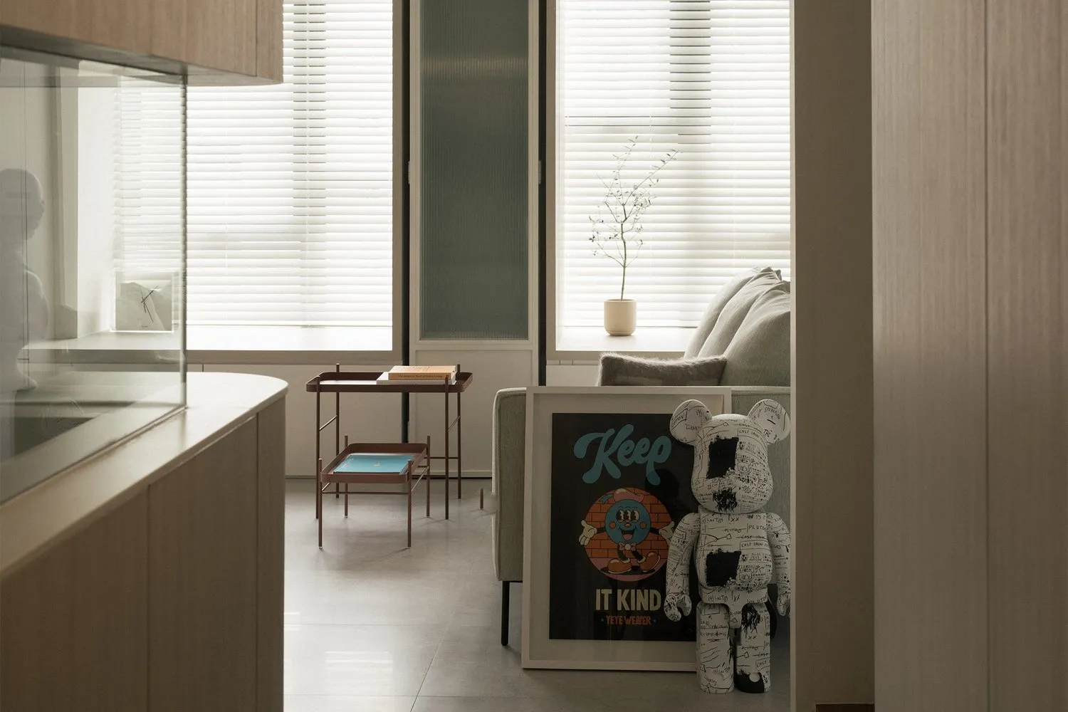 A minimalist living room with neutral tones and modern furniture.