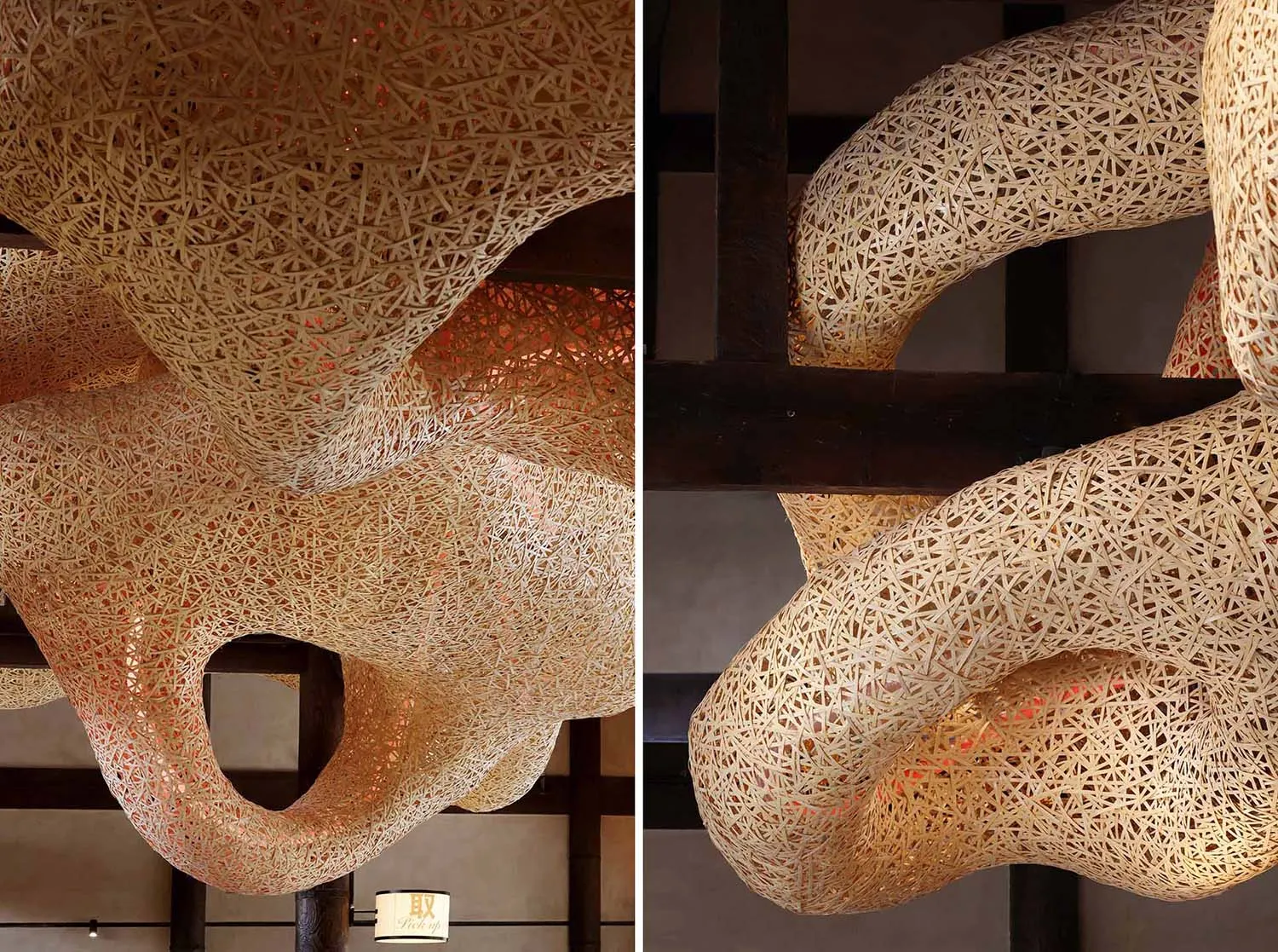 A modern abstract sculpture made of woven metal, resembling a fabric or spider web, adds character to a building's interior with an atmosphere of intrigue and creativity