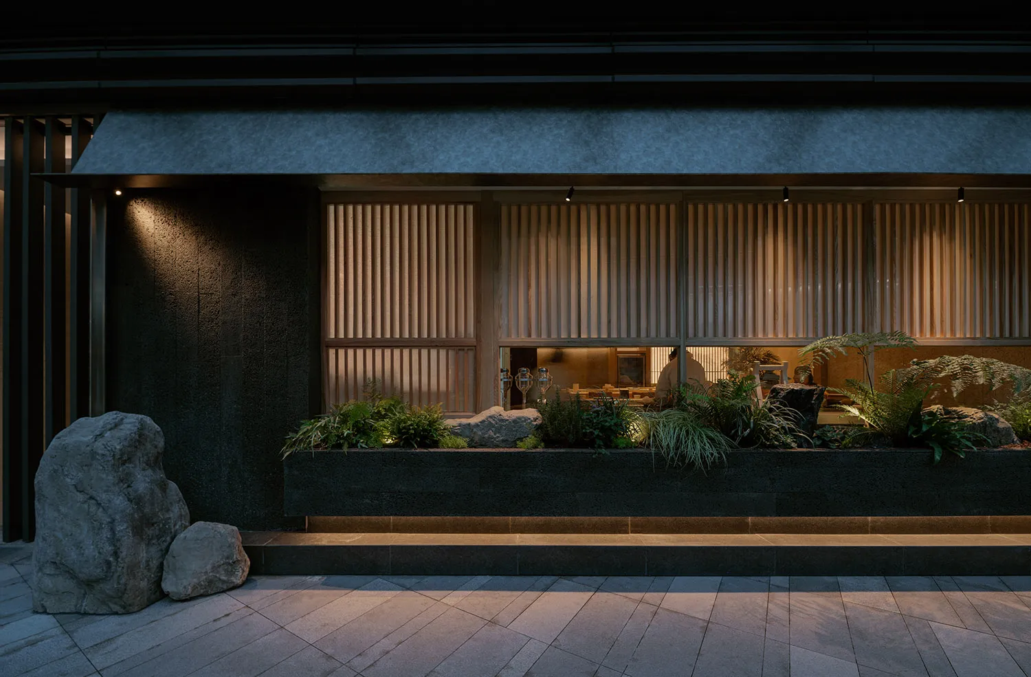 Elegant living space with a black and white color scheme, featuring potted plants, vases, and a well-organized atmosphere