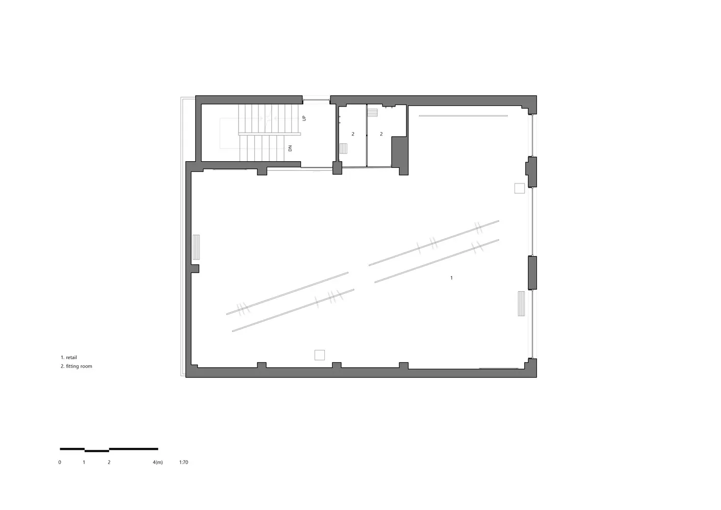 Empty minimalist hallway with concrete walls and a long corridor leading to another room
