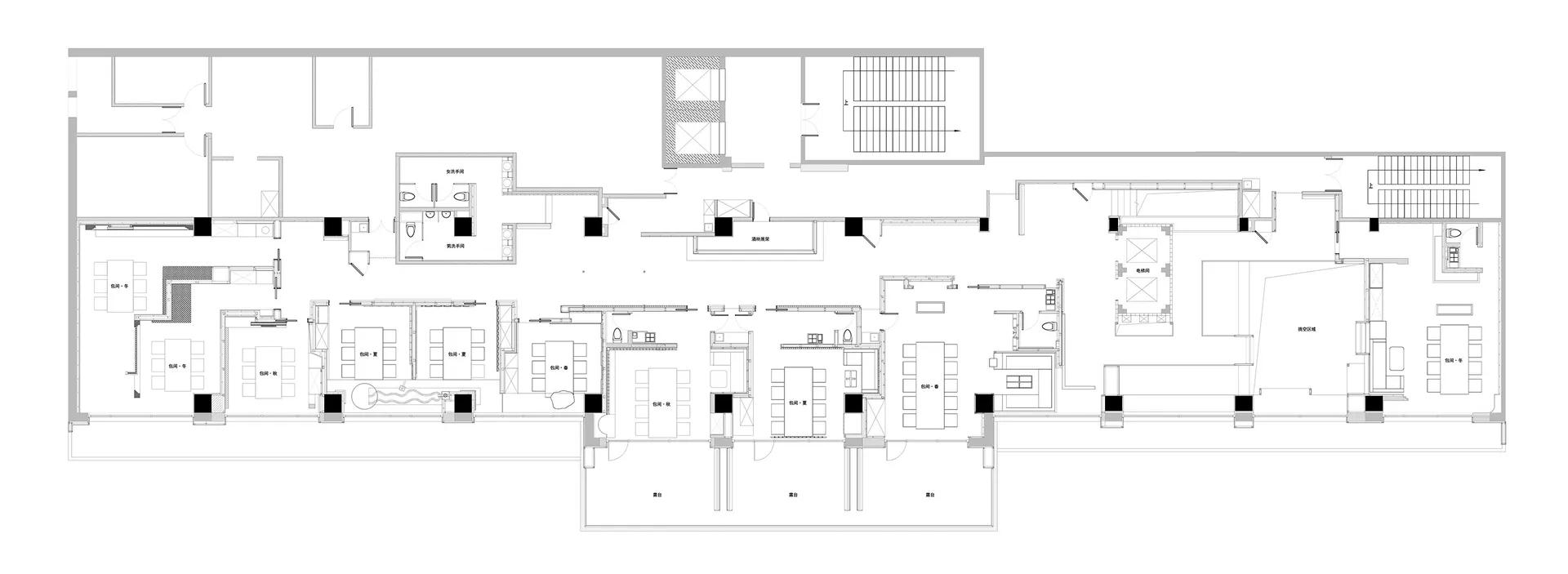 Well-lit modern kitchen with white walls, black accents, and various appliances