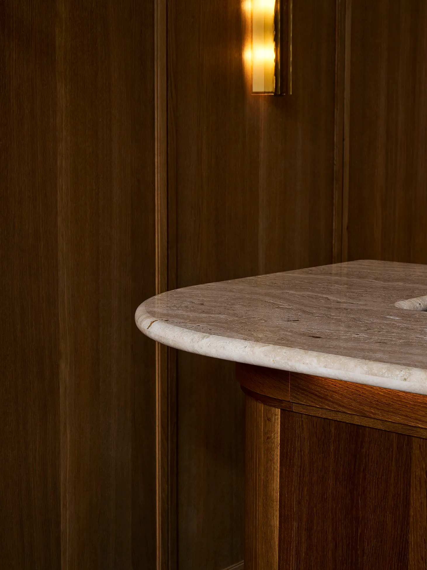 A wooden kitchen countertop with a marble finish, featuring a warm and elegant appearance due to the wood grain