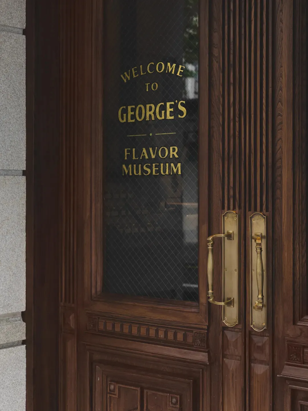 A warm and inviting entrance with a wooden door, gold handles, and a glass window displaying the museum's name in gold letters