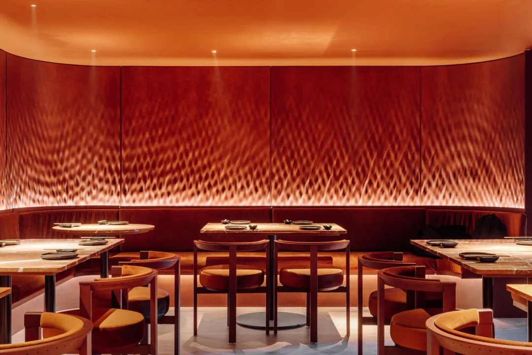 Cozy restaurant with brown tables and chairs, warm ambiance, and inviting atmosphere