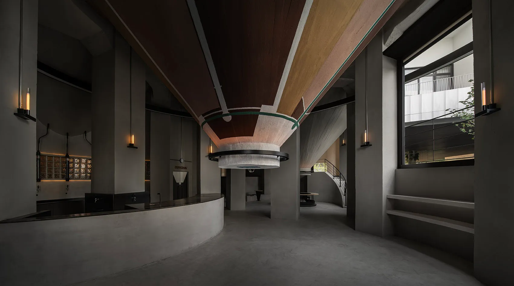 A modern lobby with a circular wooden ceiling, multiple chairs, and two dining tables, creating a warm and inviting atmosphere