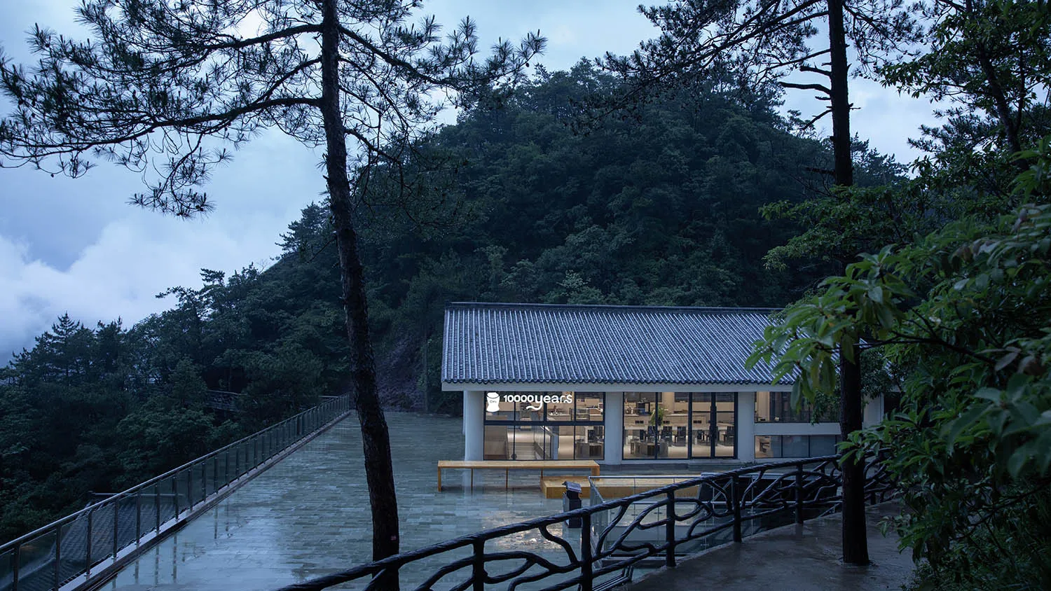 Modern restaurant with a mountain view, featuring a dining area with multiple chairs and a stylish design