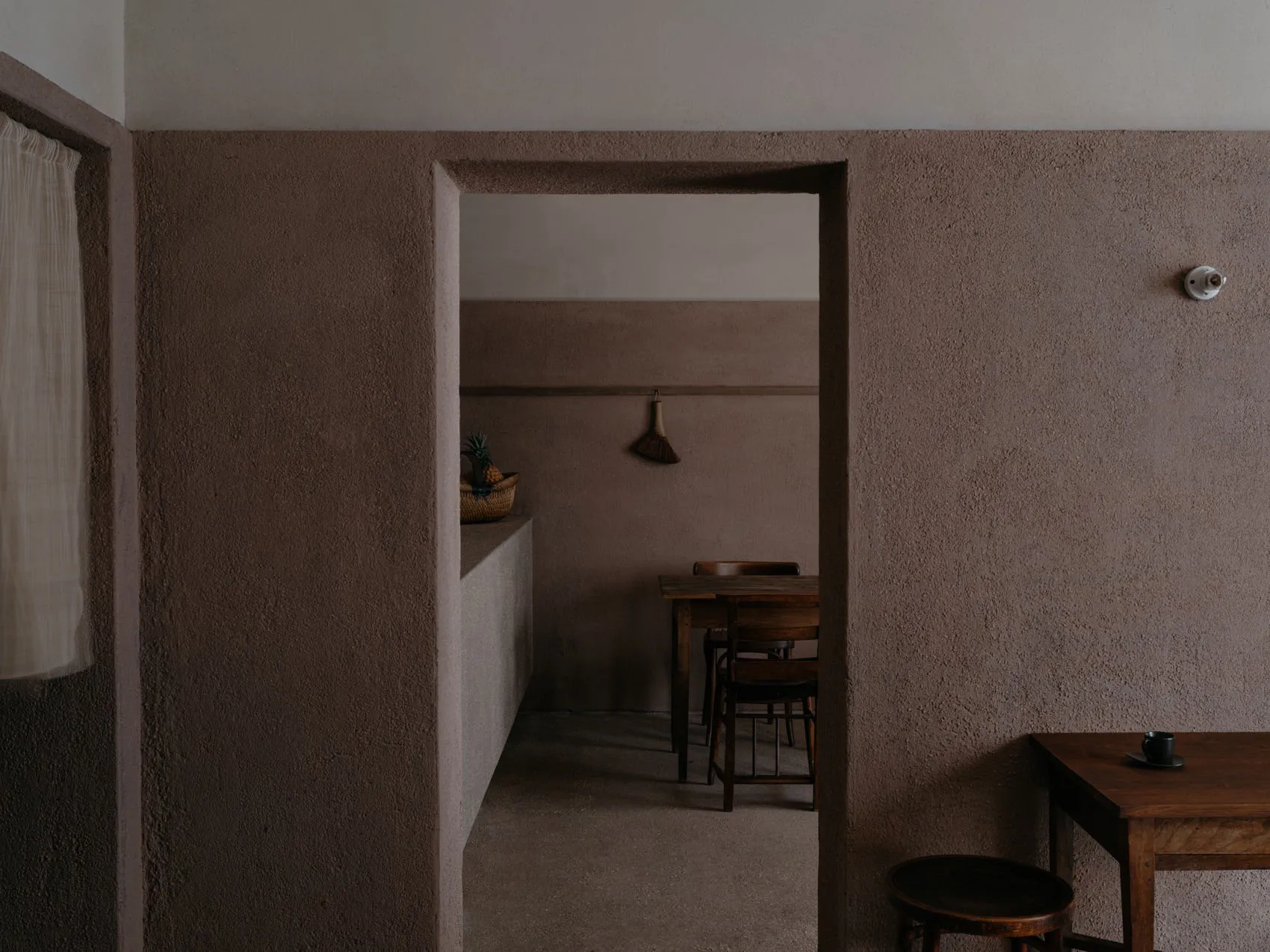 Cozy dining space with stone walls, wooden furniture, and a warm atmosphere