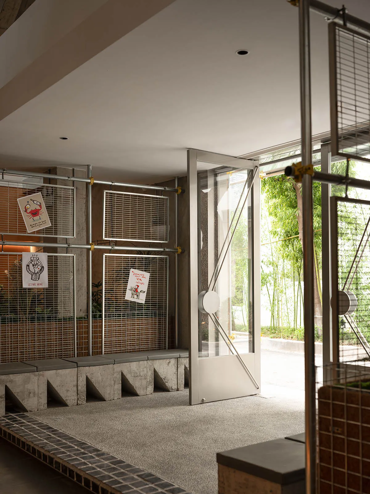 A functional entrance area with a concrete hallway, two doors, and a modern industrial feel