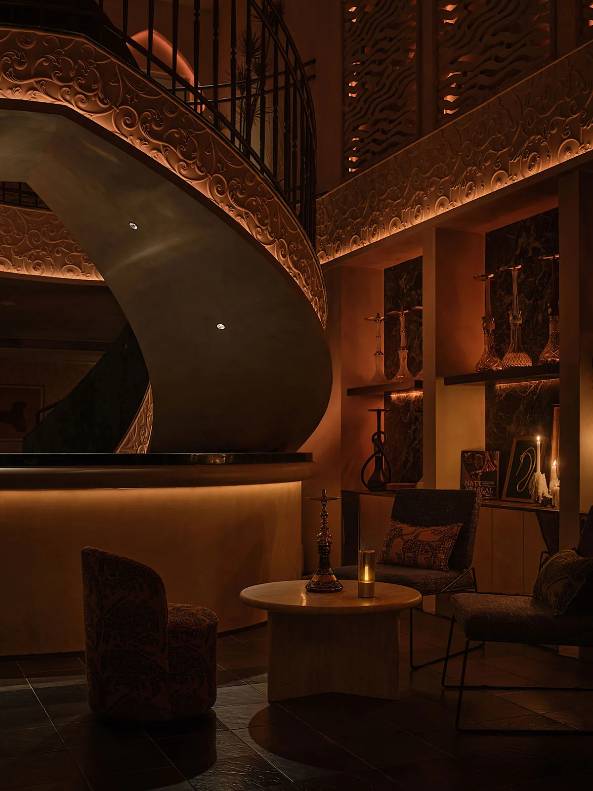 Warm and inviting living space with a spiral staircase, wooden elements, and comfortable furniture