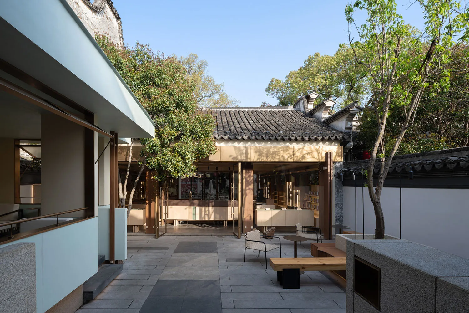 Inviting open space with seating areas, wood, and stone elements, designed for socializing and relaxation
