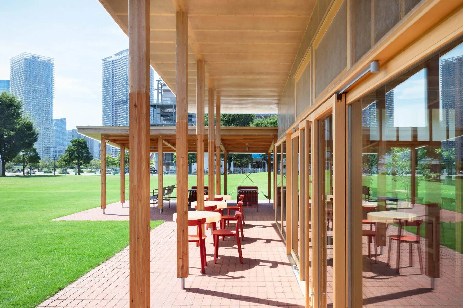 An outdoor dining area with wooden structures and furniture, creating a warm and inviting atmosphere for social gatherings or events