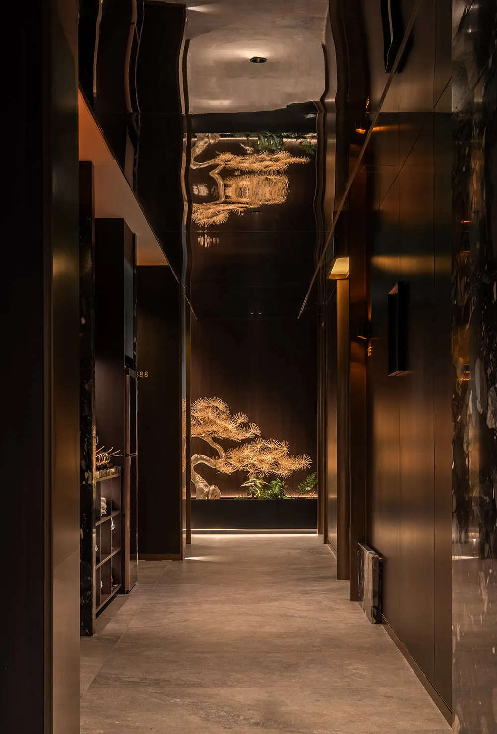 A modern hallway with a large artistic tree design on the wall, well-lit and featuring a contemporary style with artistic elements