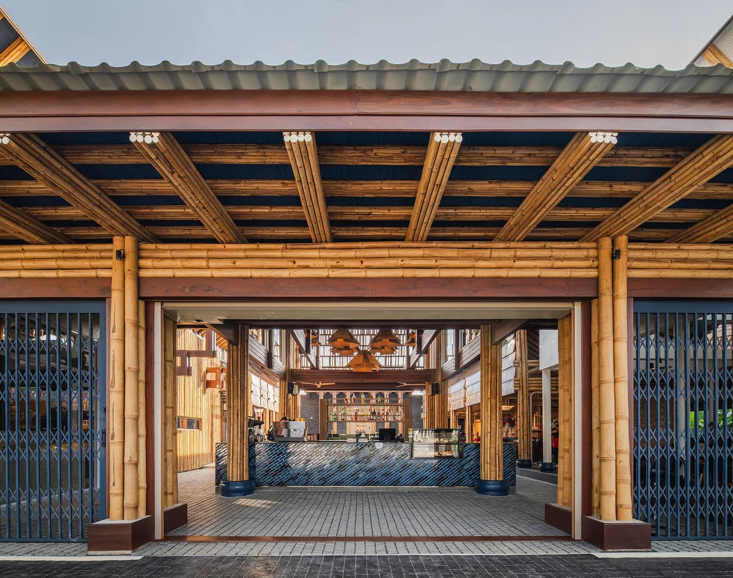 Open social space with wooden walls and ceiling, people walking and conversing