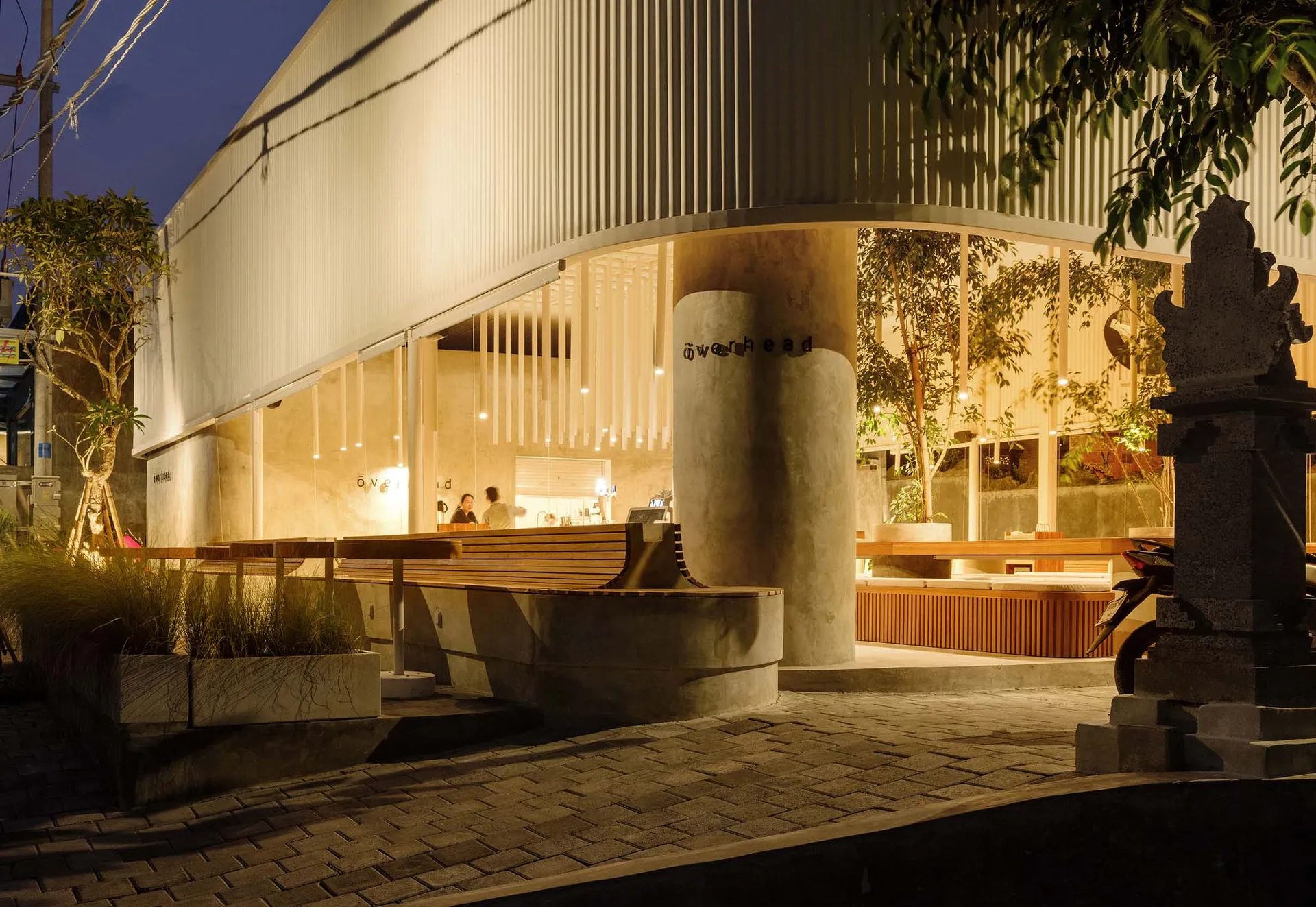 Open restaurant interior with multiple tables, white walls, and comfortable seating for guests