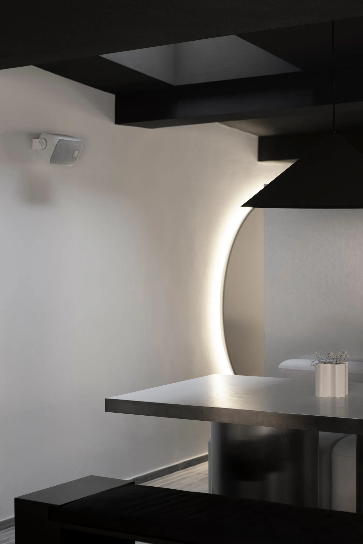 A modern kitchen with two sinks, a countertop, and a mirror above, creating a clean and organized atmosphere