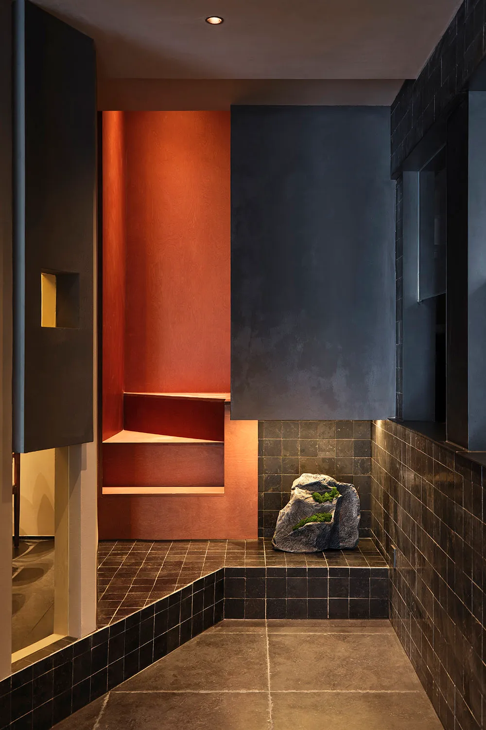 Bathroom with a black stone tile floor, modern fixtures, and a clean aesthetic